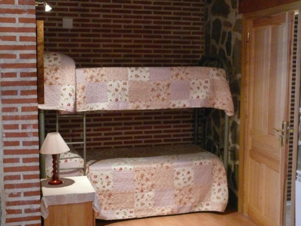 A bed or beds in a room at Abadía del Marqués de Avila
