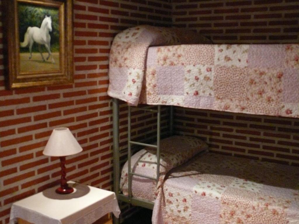 A bed or beds in a room at Abadía del Marqués de Avila