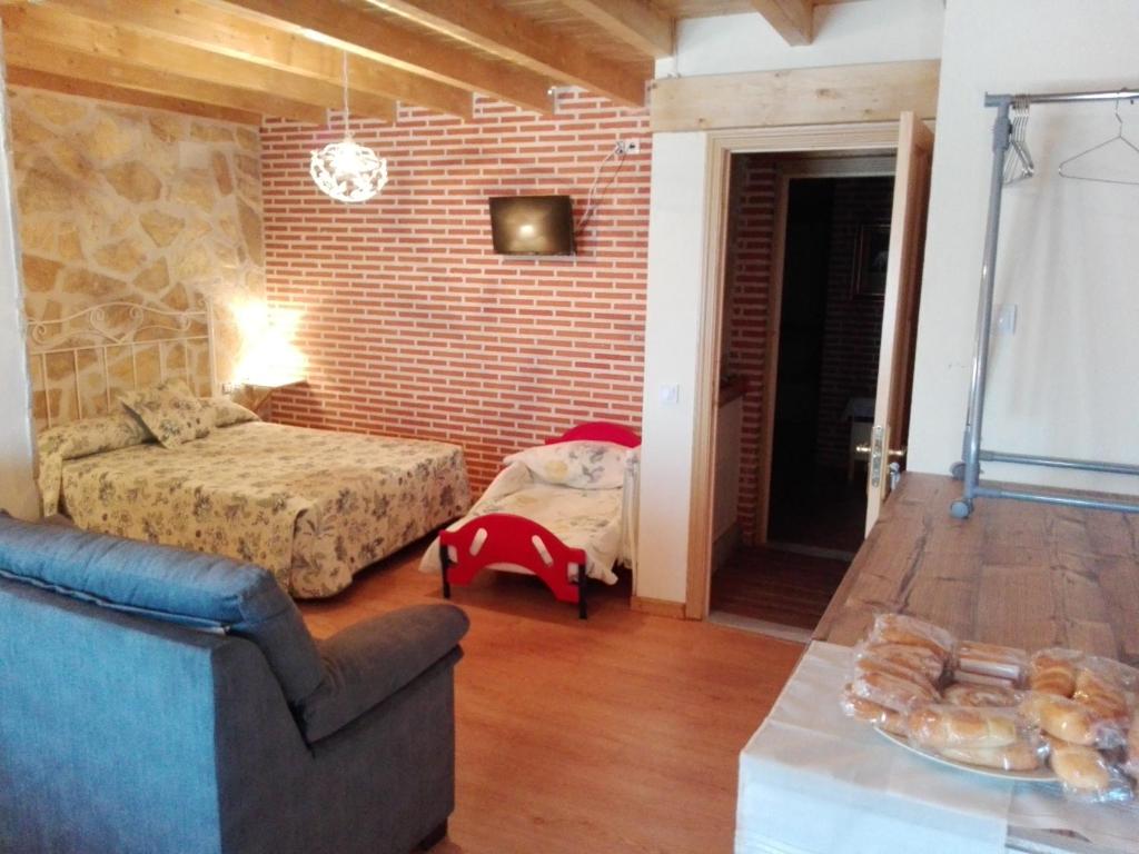 A bed or beds in a room at Abadía del Marqués de Avila