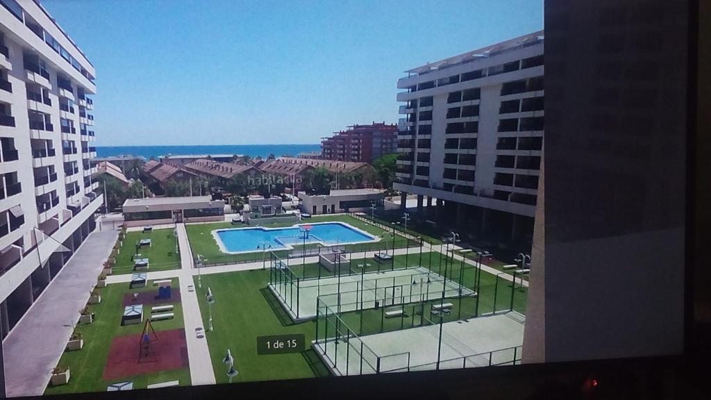 a view of a pool from a building at Apartacona-Playa in Valencia