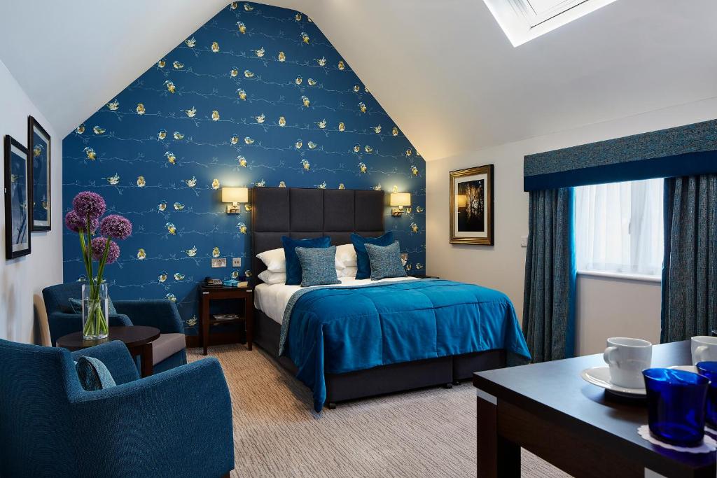 Un ou plusieurs lits dans un hébergement de l'établissement Mandolay Hotel Guildford