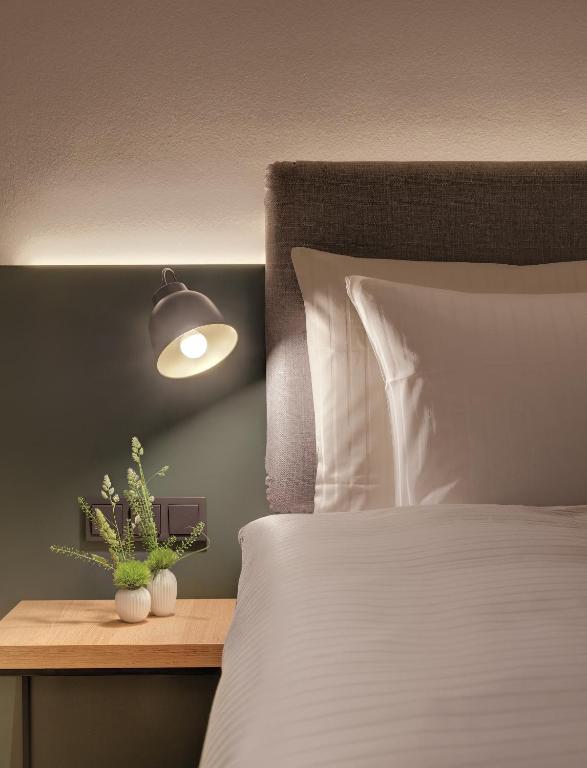 Postel nebo postele na pokoji v ubytování Hotel the YARD Berlin