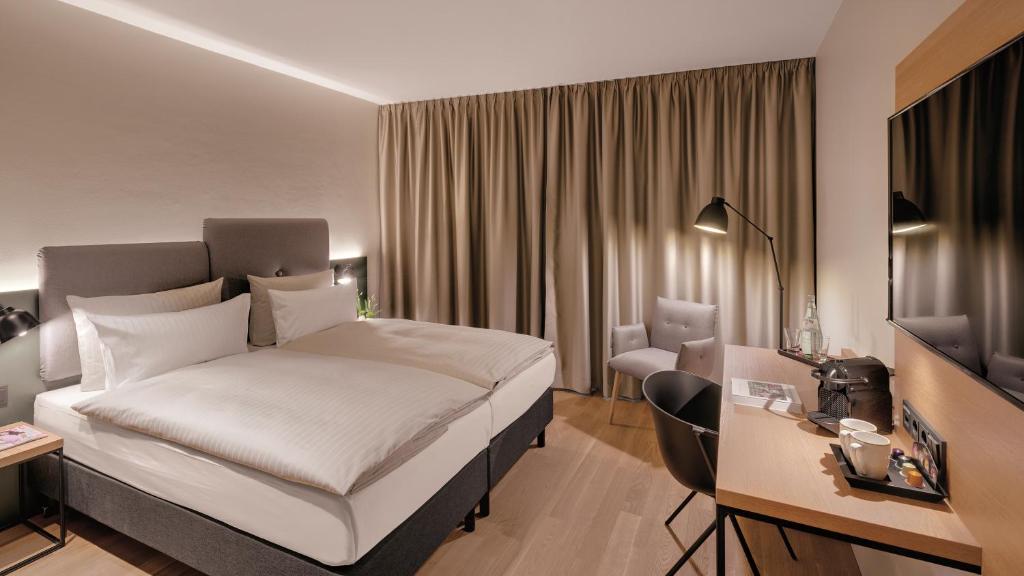 Postel nebo postele na pokoji v ubytování Hotel the YARD Berlin