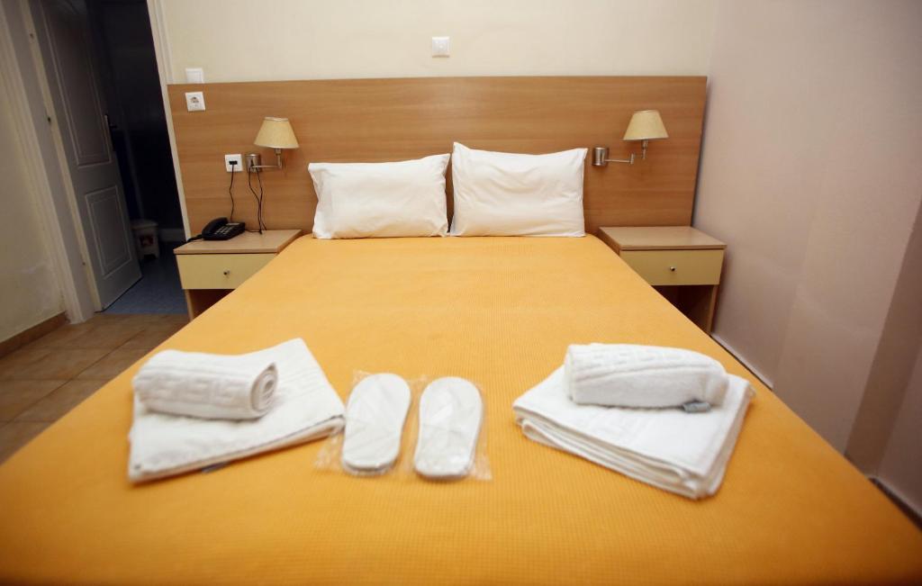 Voodi või voodid majutusasutuse Aggelos Hotel toas