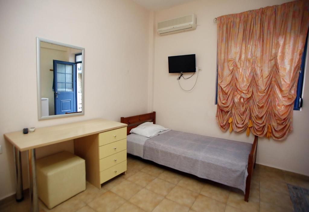 Voodi või voodid majutusasutuse Aggelos Hotel toas