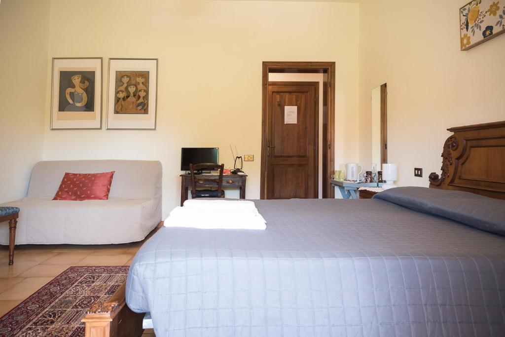 Postel nebo postele na pokoji v ubytování B&B San Russorio