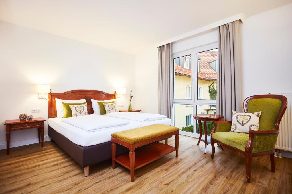 Postel nebo postele na pokoji v ubytování Hotel Prinzregent München Messe