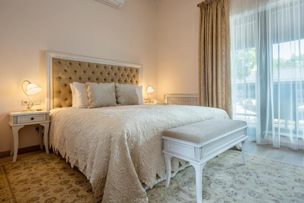 Postel nebo postele na pokoji v ubytování Hotel Pušų paunksnėje