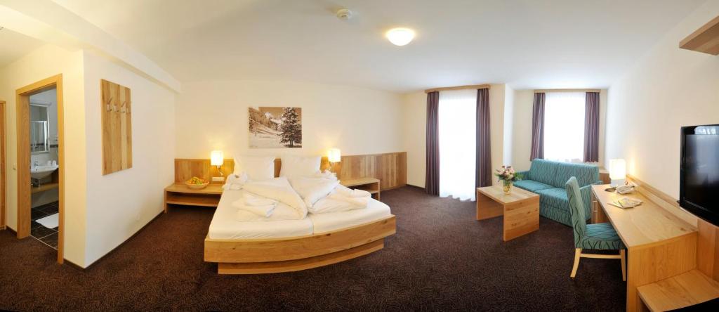 Postel nebo postele na pokoji v ubytování Panoramahotel Gürtl