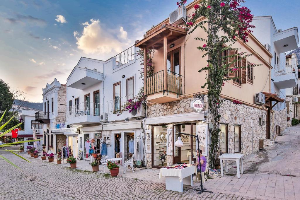 a street in a town with white buildings at Pier Aparts in Kalkan