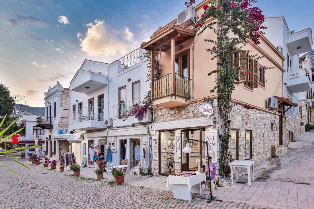 a street in a town with white buildings at Pier Rooms & Pansiyon in Kalkan