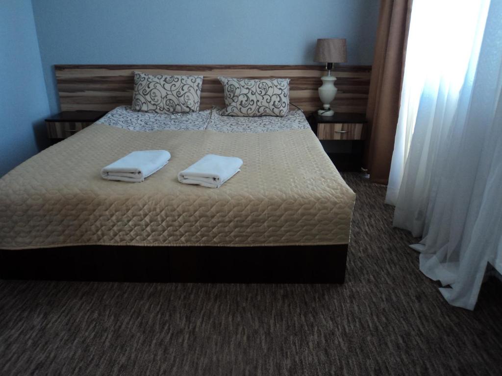 Postel nebo postele na pokoji v ubytování Hotel Restaurant Vizit