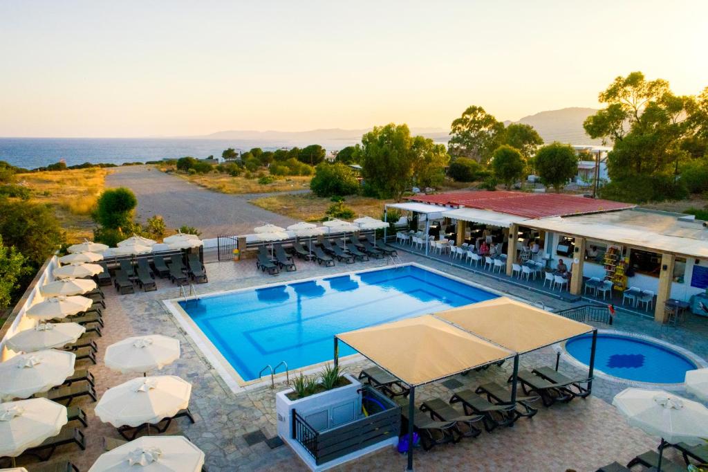 an aerial view of a resort with a swimming pool at Amphitriti Hotel in Pefki