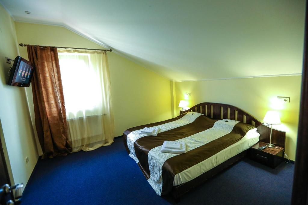 Postel nebo postele na pokoji v ubytování Home Hotel