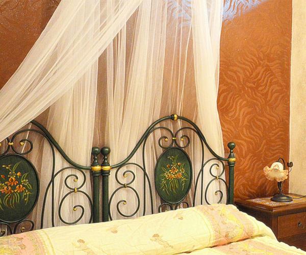 Postel nebo postele na pokoji v ubytování B&B TascaPachino
