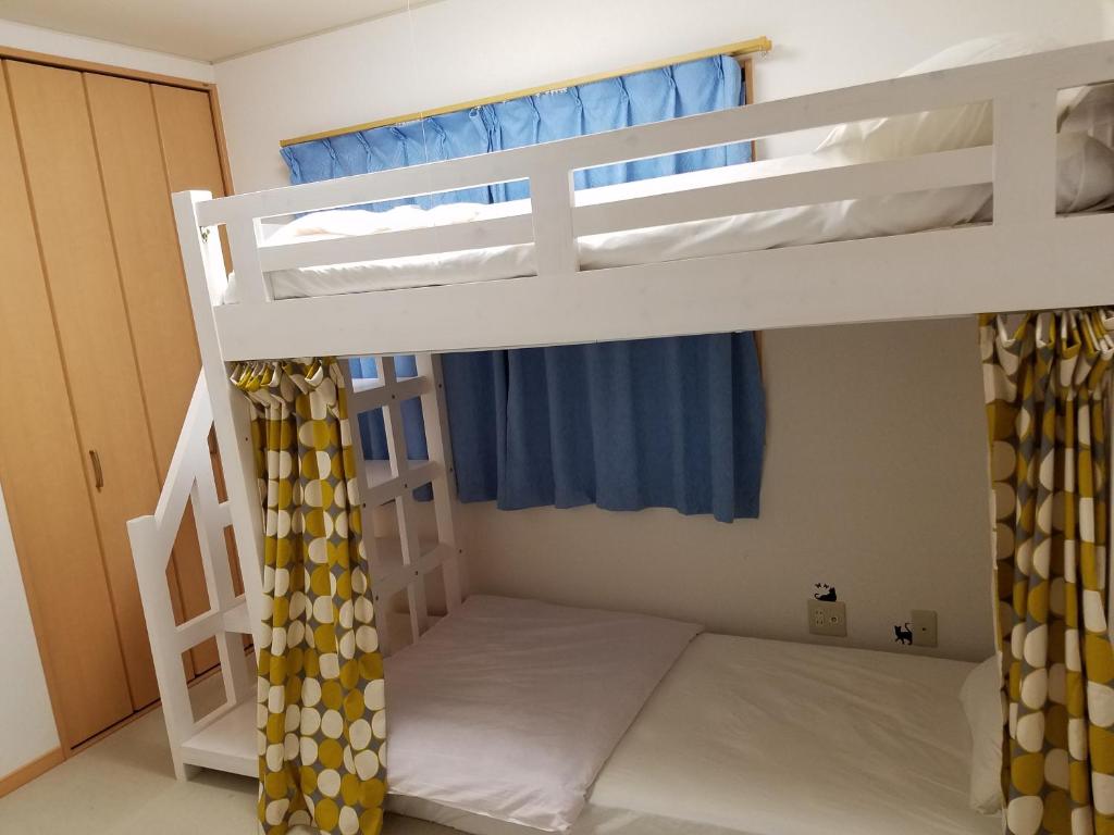 Postel nebo postele na pokoji v ubytování Villa M Guesthouse