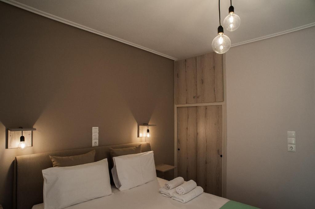 En eller flere senge i et værelse på Kochili Apartments