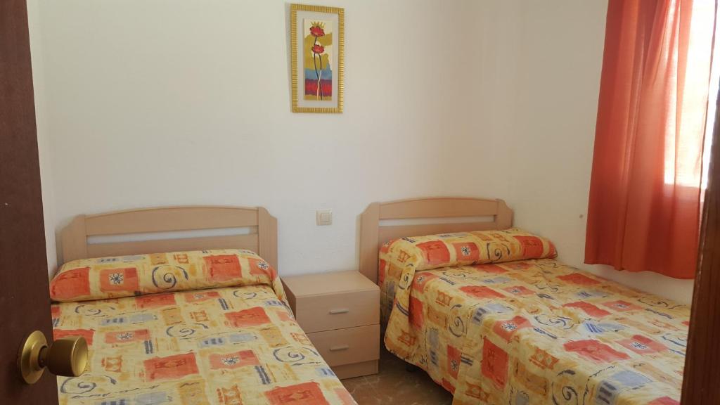 Postel nebo postele na pokoji v ubytování Camping Los Pinos