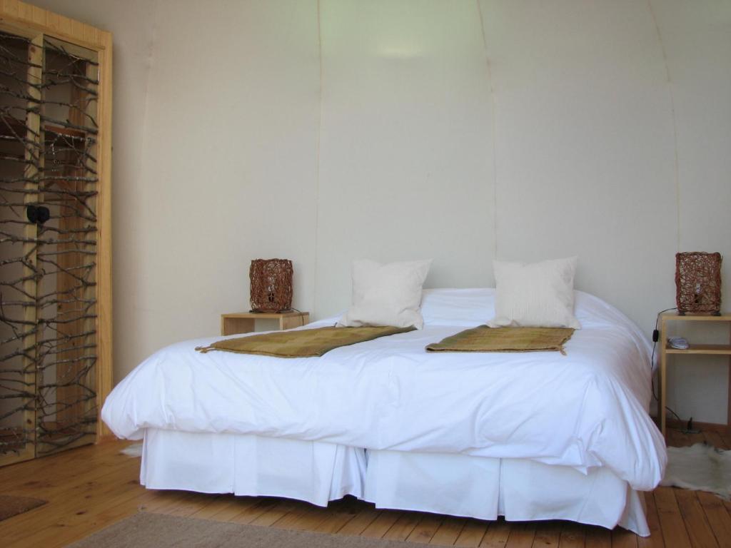 Cama ou camas em um quarto em Magma Lodge, Pucon