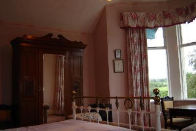 Postel nebo postele na pokoji v ubytování Woodhill House