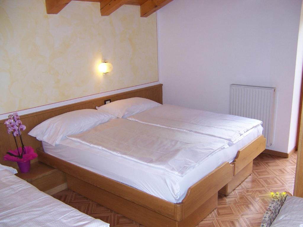 Postel nebo postele na pokoji v ubytování Alpen Hotel Rabbi
