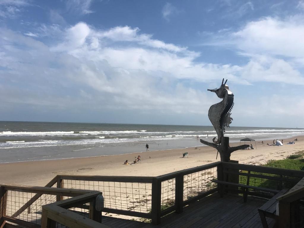 a statue of a seahorse on the beach at Ocean Village Hotel in Surfside Beach