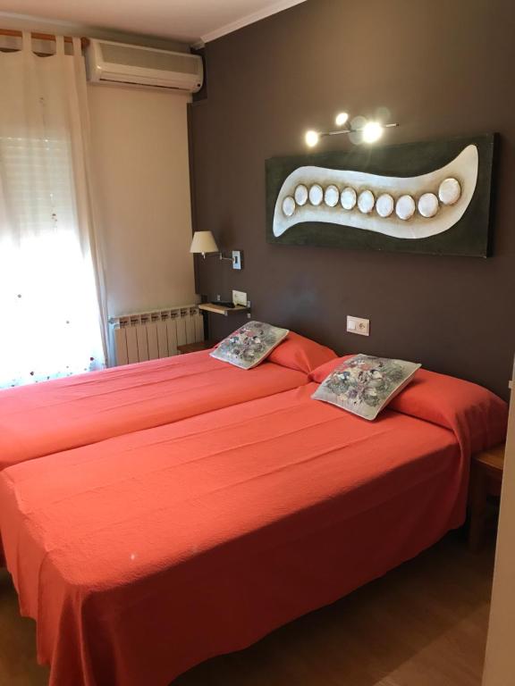 Postel nebo postele na pokoji v ubytování Hostal Delgado