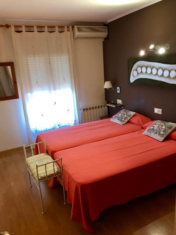 Postel nebo postele na pokoji v ubytování Hostal Delgado