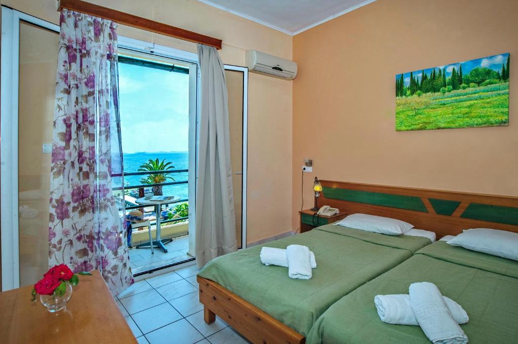 Postel nebo postele na pokoji v ubytování Costa Hotel