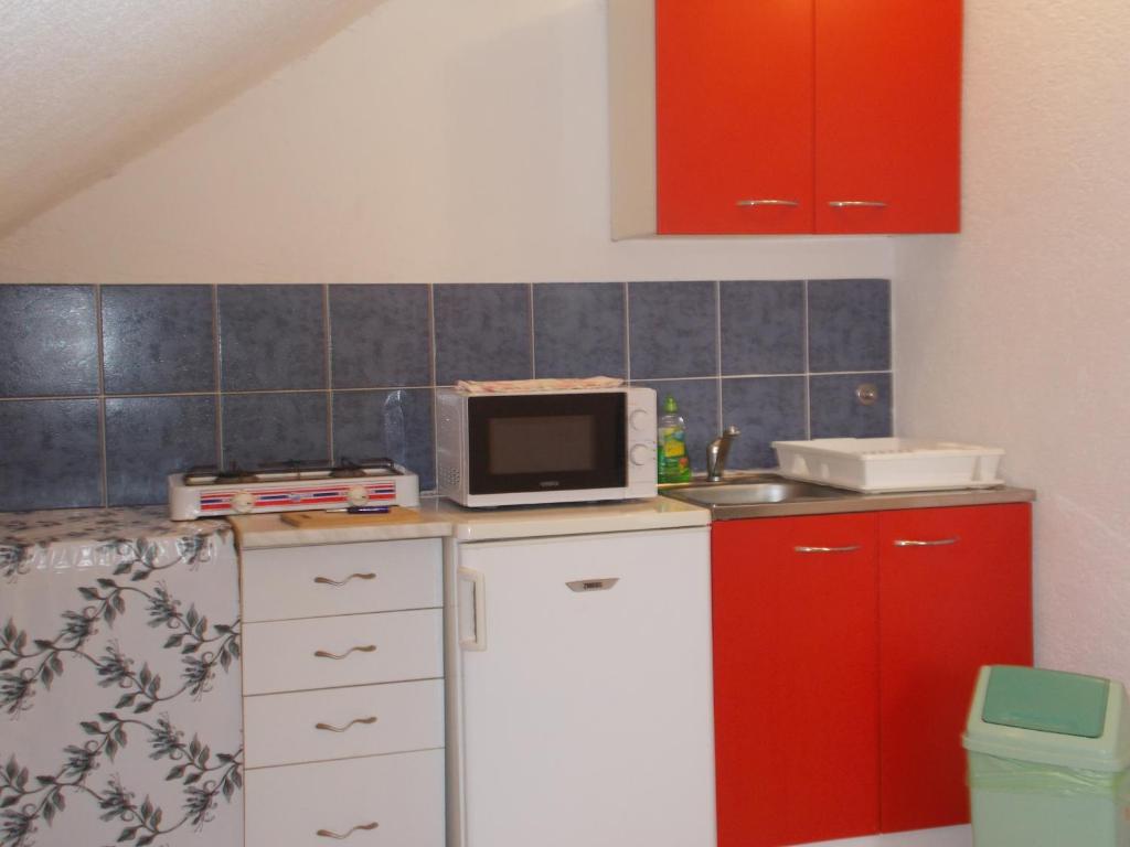 Kuchyň nebo kuchyňský kout v ubytování Apartments 031