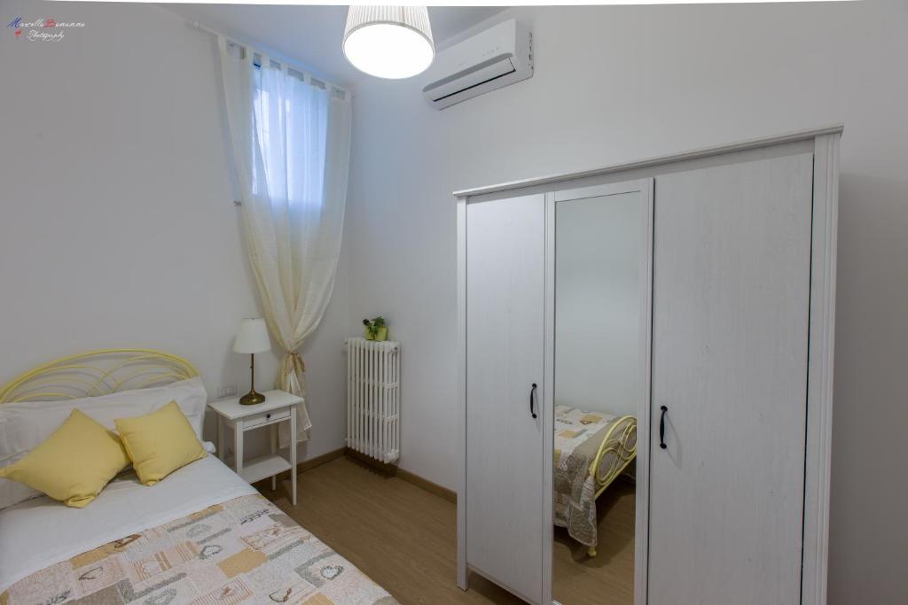 Łóżko lub łóżka w pokoju w obiekcie B&B A Casa dei Nonni