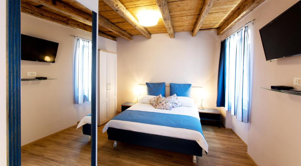 Postel nebo postele na pokoji v ubytování Guesthouse Centrum B&B