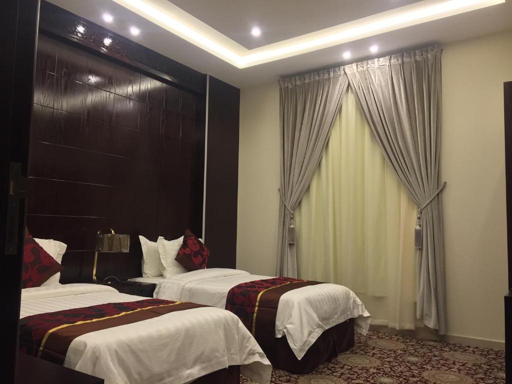 Postel nebo postele na pokoji v ubytování Elaf Aparthotel