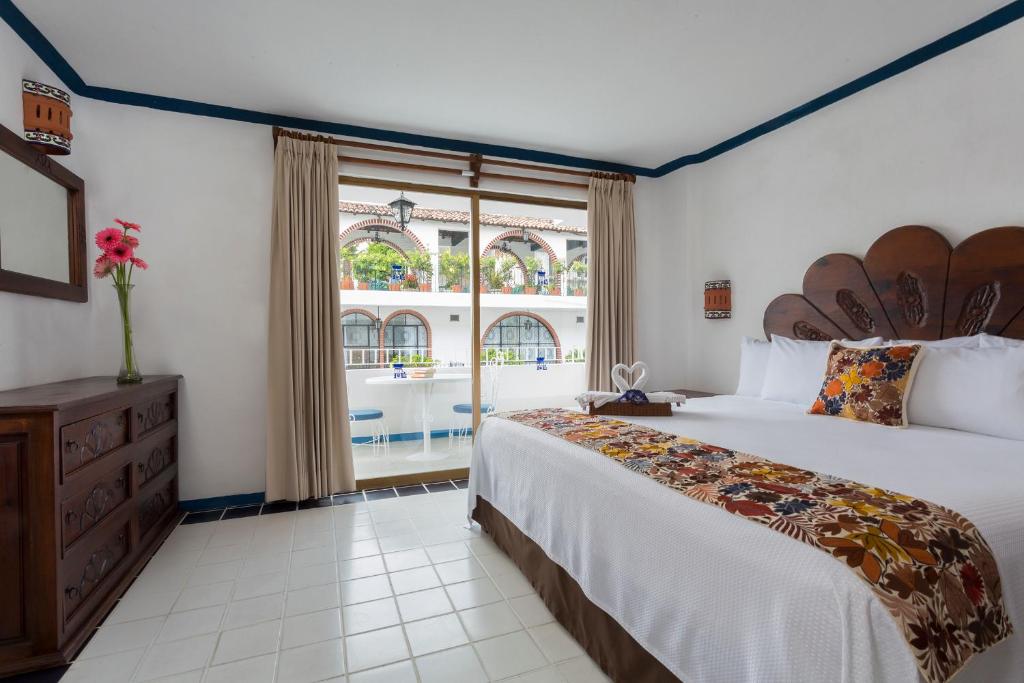 Postel nebo postele na pokoji v ubytování Los Arcos Suites
