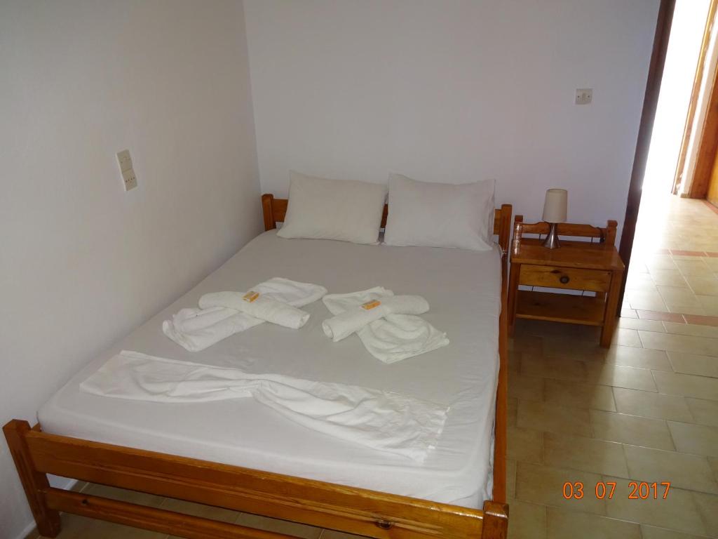 Postel nebo postele na pokoji v ubytování Scirocco Rooms