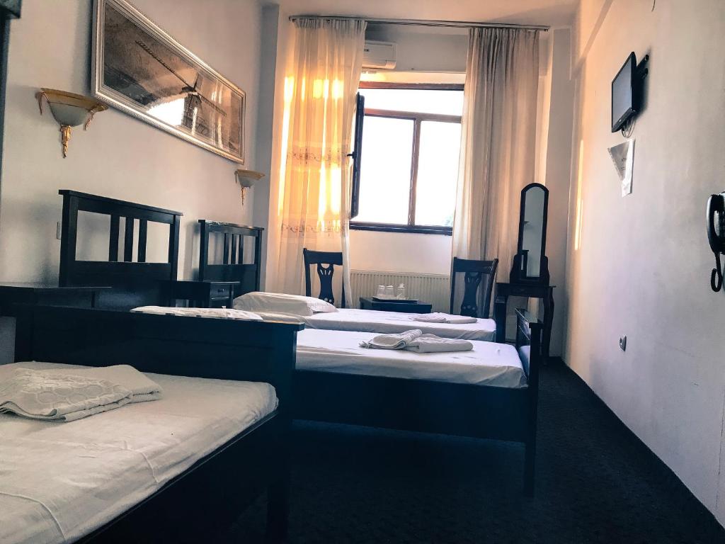 Postel nebo postele na pokoji v ubytování Hotel Funnytime