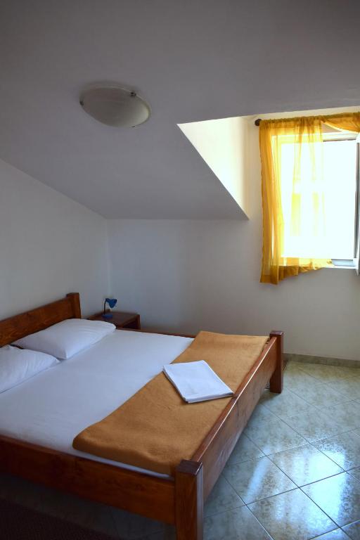 Postel nebo postele na pokoji v ubytování Apartments Matulic