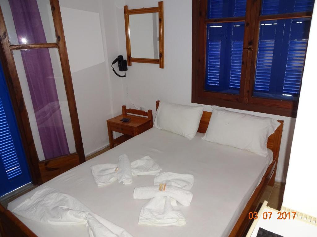 Postel nebo postele na pokoji v ubytování Scirocco Rooms