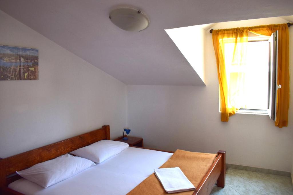 Postel nebo postele na pokoji v ubytování Apartments Matulic