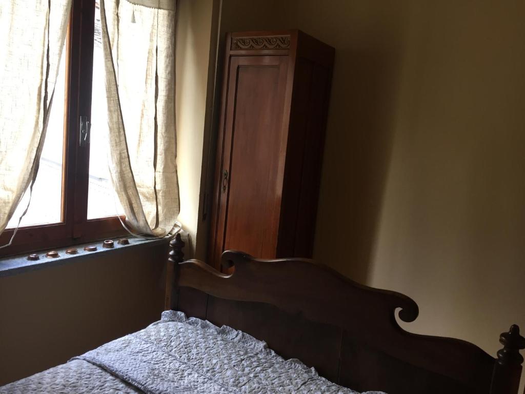 A bed or beds in a room at Da Duccio e Maria