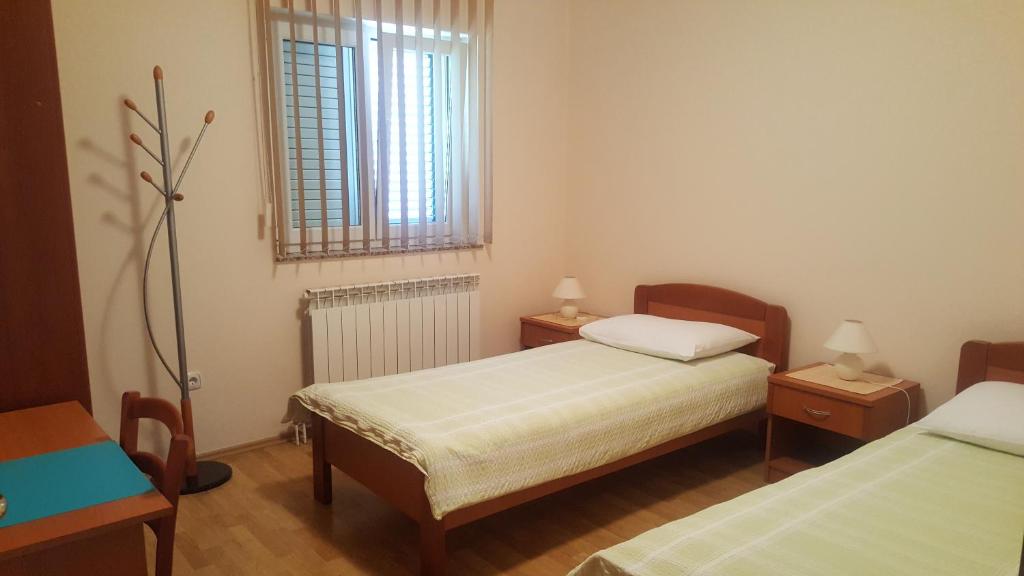 Postel nebo postele na pokoji v ubytování Apartments Barbara