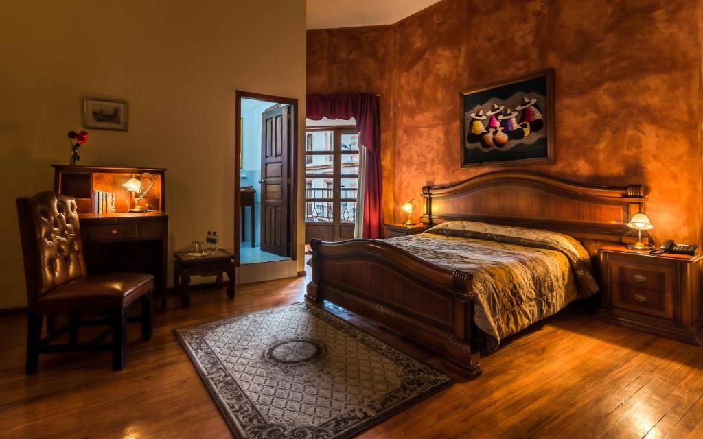 Postel nebo postele na pokoji v ubytování Hotel San Francisco De Quito