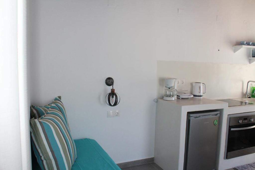 a kitchen with a sink and a counter top at Studios Betty in Plaka Milou