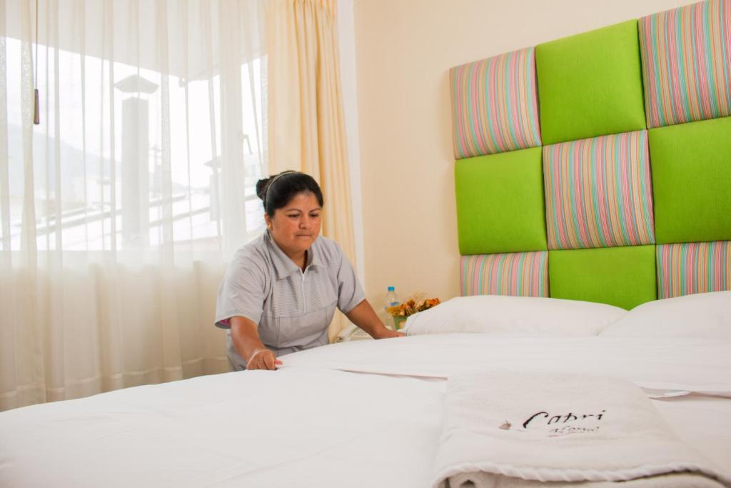 Členové personálu v ubytování Hostal Capri