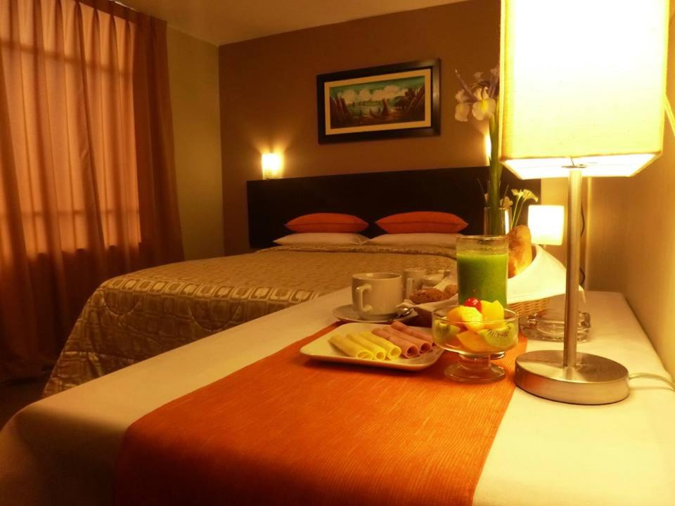 Letto o letti in una camera di Acuario Hotel & Suite
