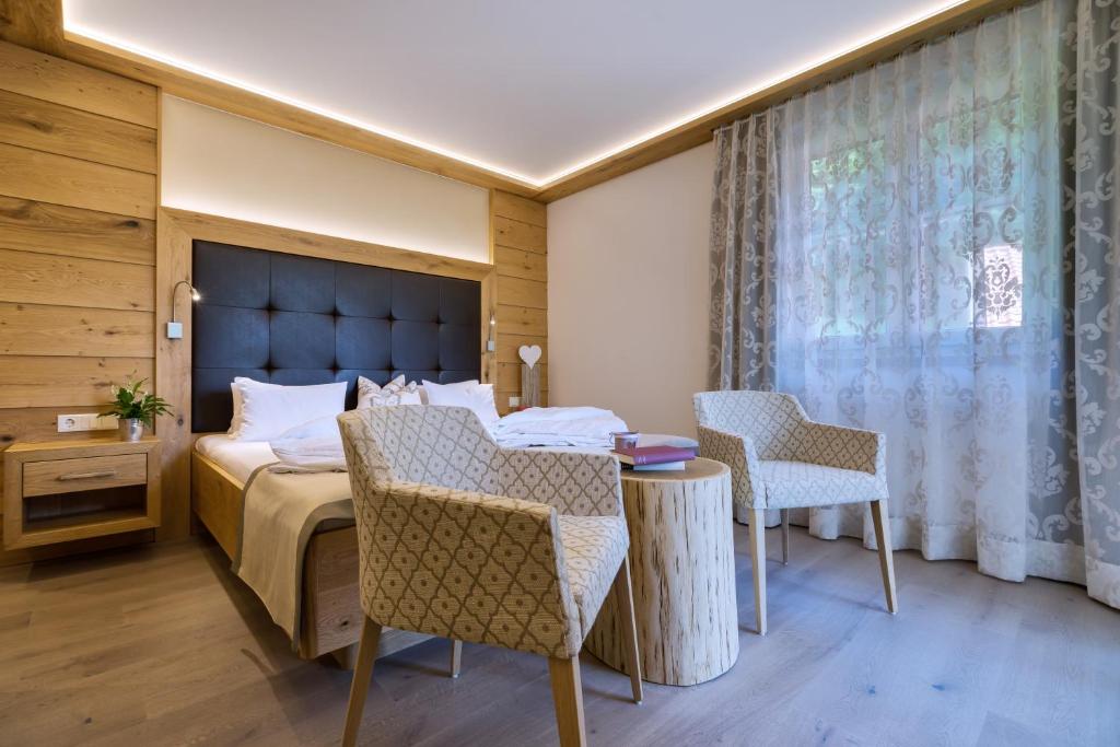 Postel nebo postele na pokoji v ubytování Hotel Fischerwirt Natur WaldSPA