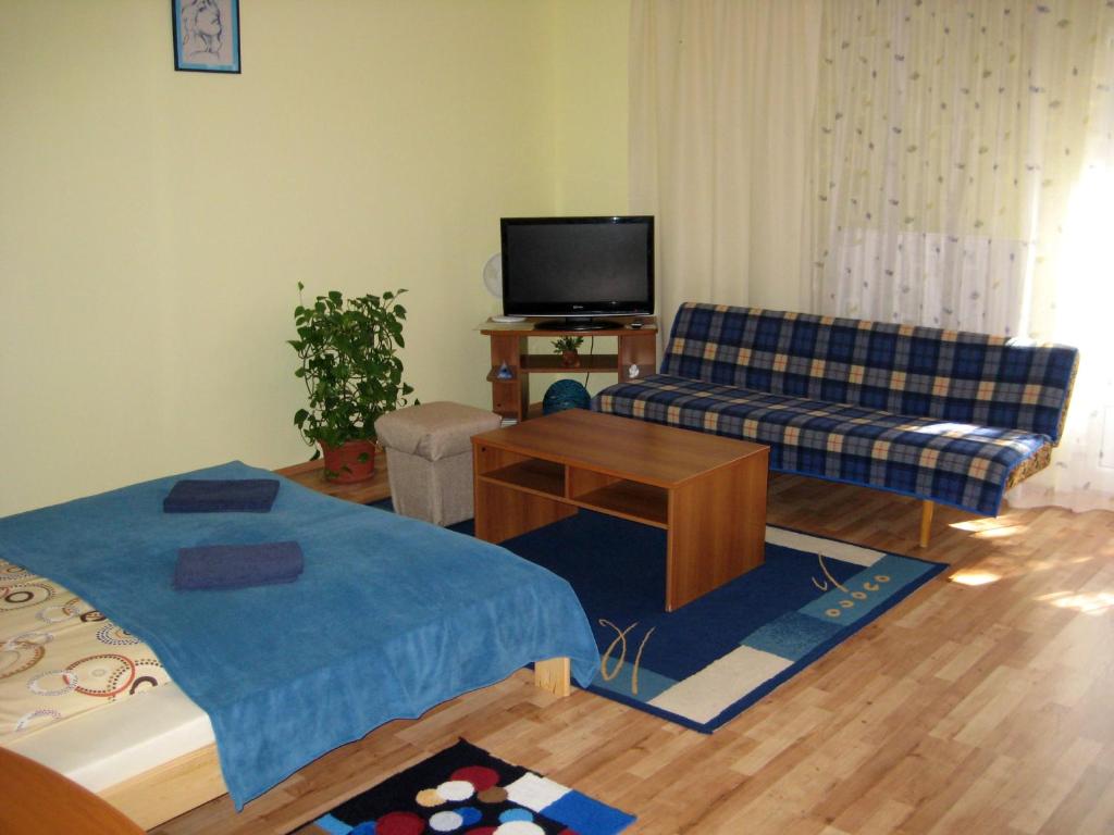 
a living room filled with furniture and a tv at Eko Penzion Leo in Dudince
