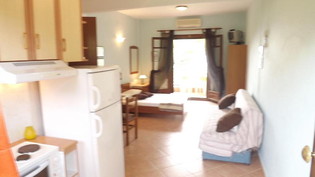 Postel nebo postele na pokoji v ubytování Pefka Studios & Apartments
