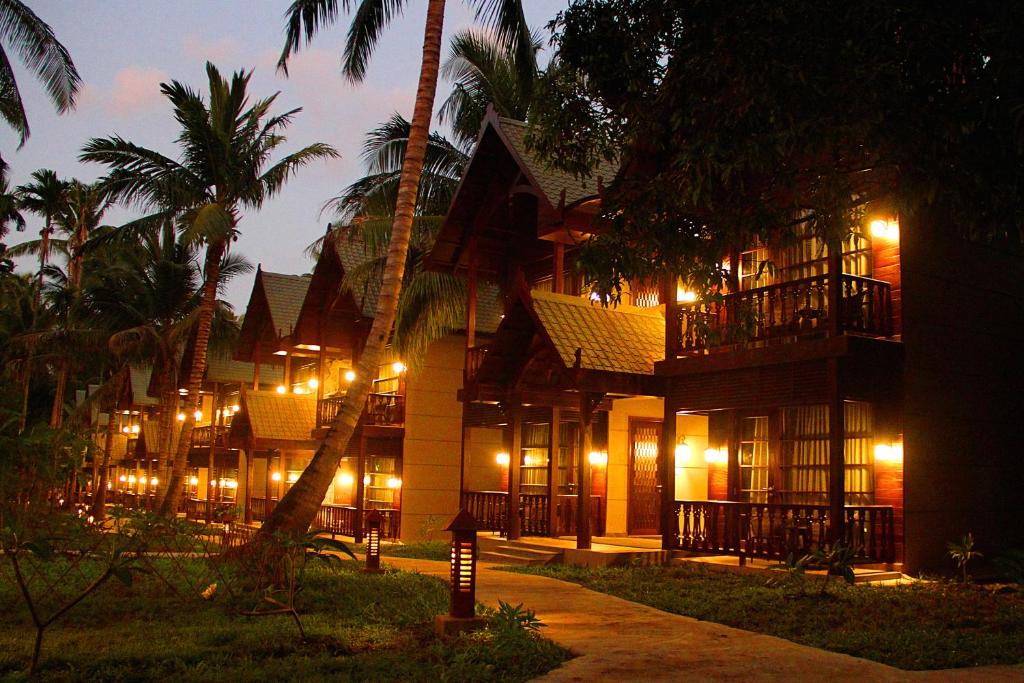 a building with lights in front of a resort at Sea Shell Neil in Neil Island