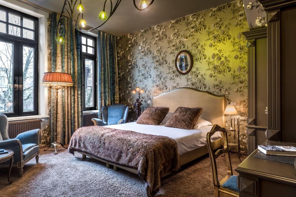 Postel nebo postele na pokoji v ubytování Main Street Hotel